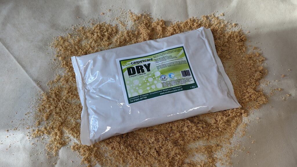 Packaged dry yeast on a bed of wood shavings.