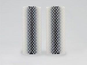 Two cylindrical brush roller attachments.